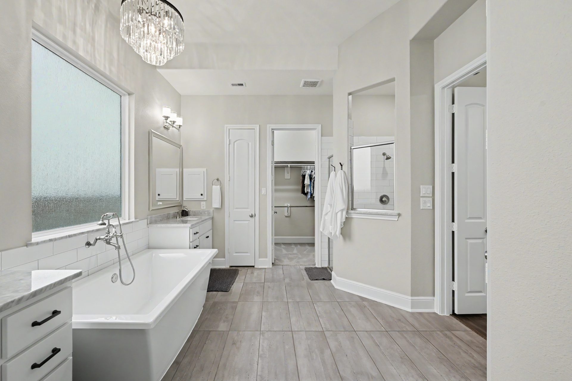 Dual vanities and crystal lighting from Arhaus