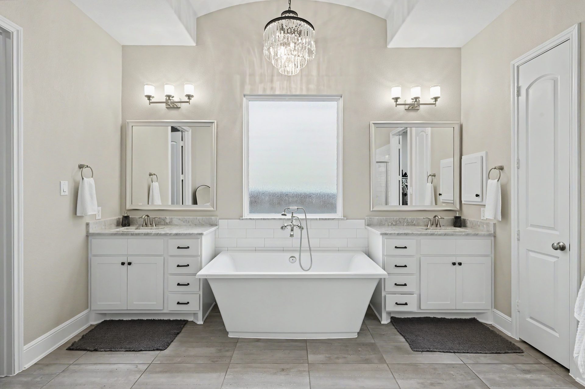 Spa-like primary bath with soaking tub, large shower and dual vanities