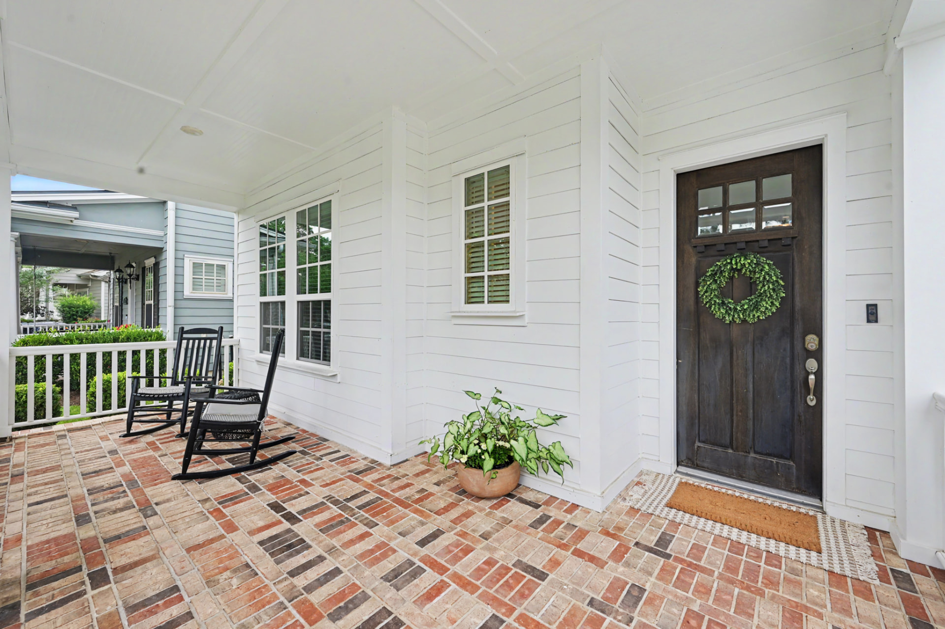 Extra large front porch with brick accents