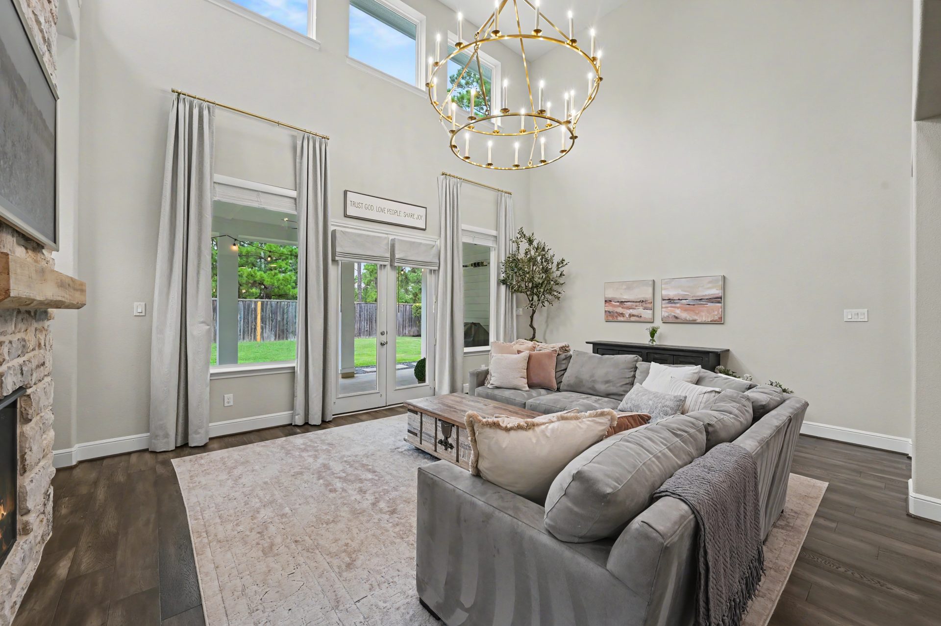 Two-story living room with wall of windows