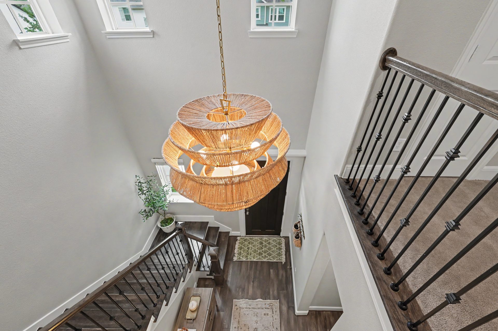Visual Comfort statement chandelier over the stairwell