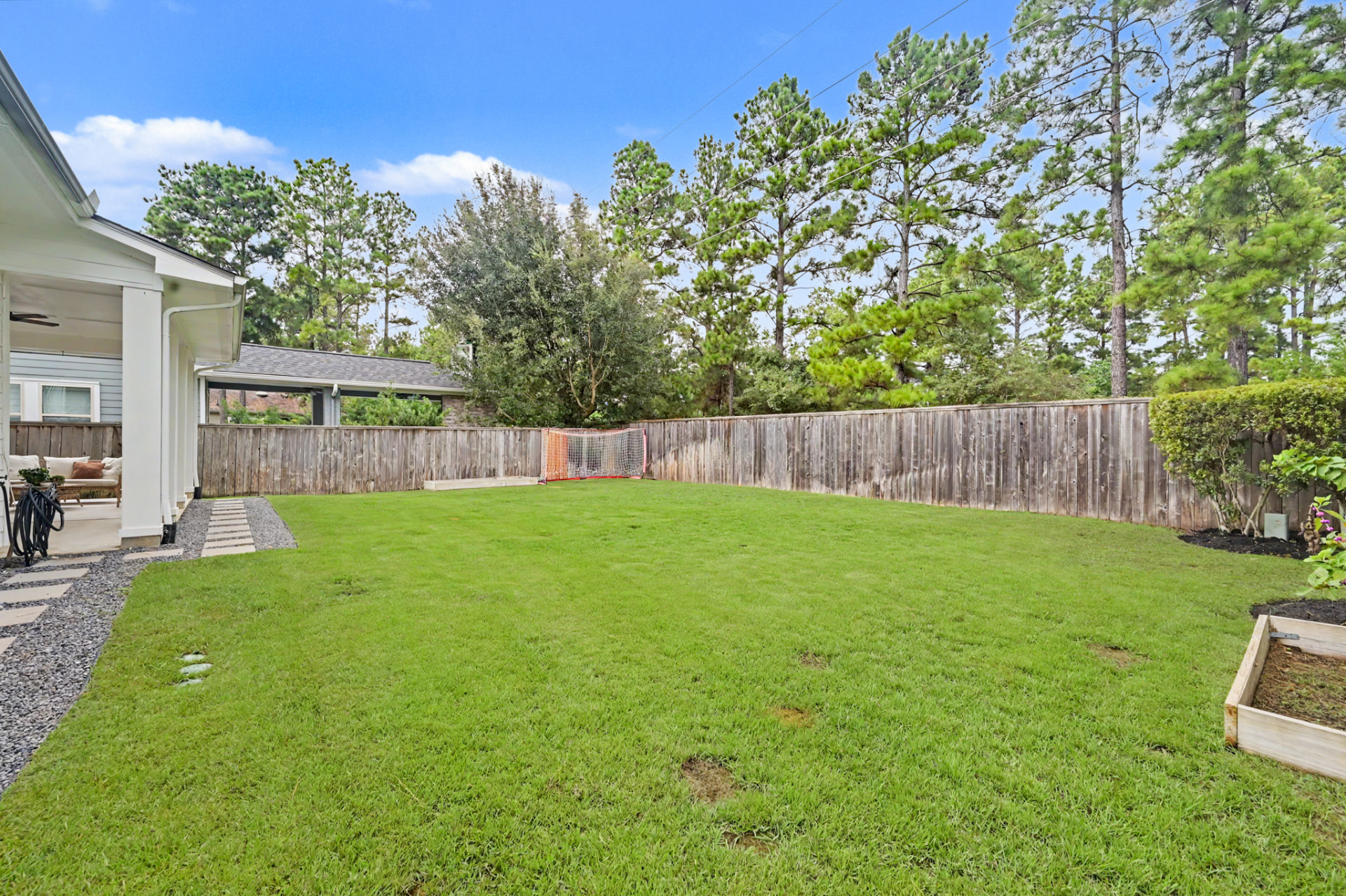 Expansive fenced backyard with no rear neighbors 