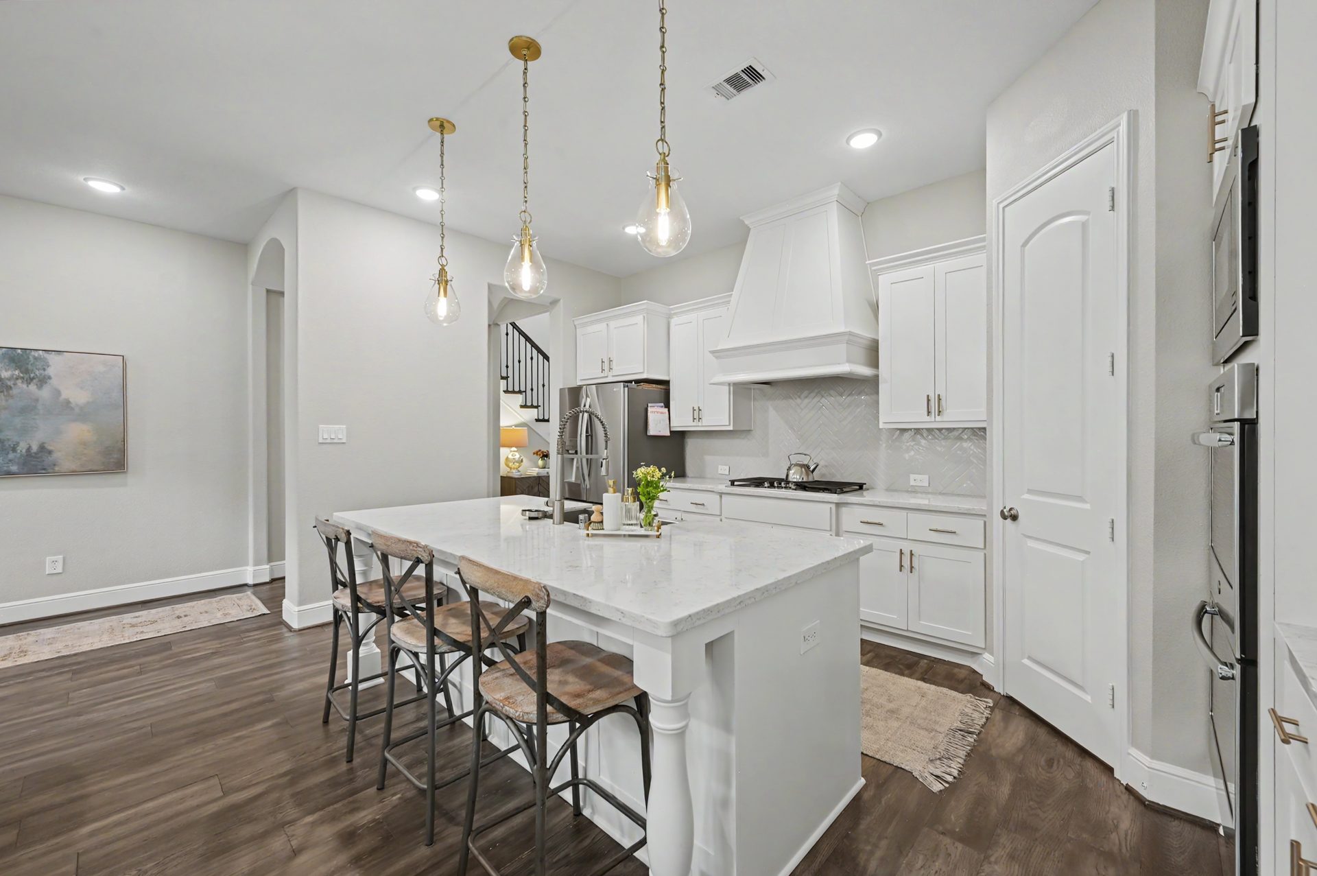 Gourmet kitchen with Becki Owens pendant lighting